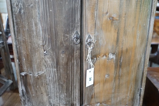 A small provincial pine two door cabinet